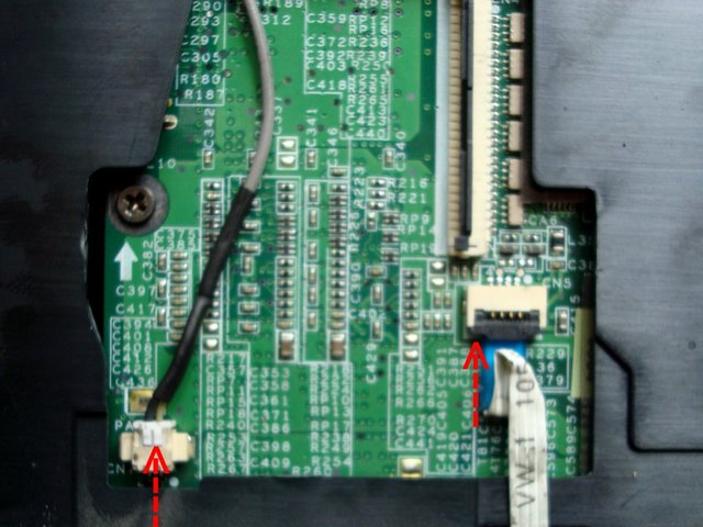 Disconnect the microphone cable and the touchpad board cable from the main board