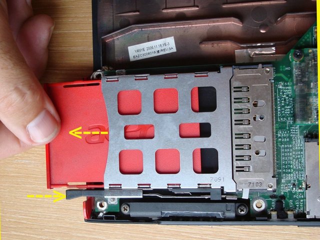 Press the dummy PC card button and remove the dummy PC card