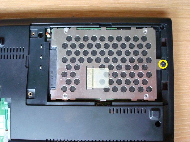 Remove the screw fastening the HDD module