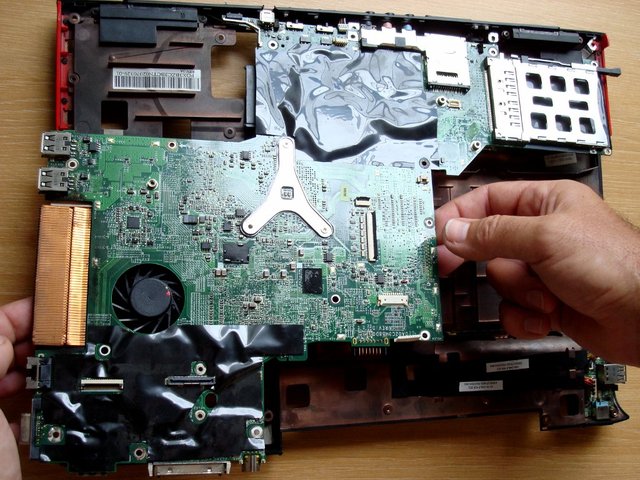 Cautiously take out the main board assembly from the lower case